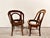 This pair of very early Wakefield Brothers chair frames are made of solid oak with elaborate carving and design. They...