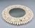 Vintage round mirror with a dense, layered shell frame — spiky whelk and cone shells radiating out from the glass, with...