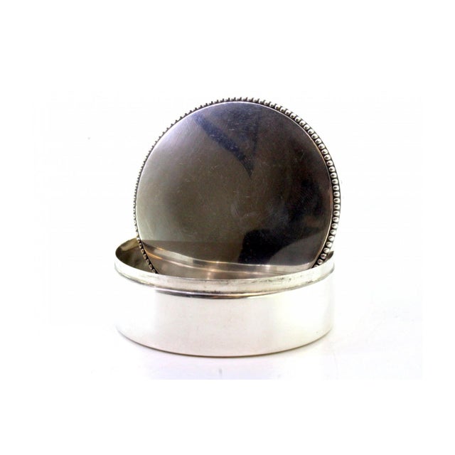 Circular Silver Box with Edge Pearls, in Very Good conditions. Designed 1920 to 1949 This piece has an attribution mark, I...