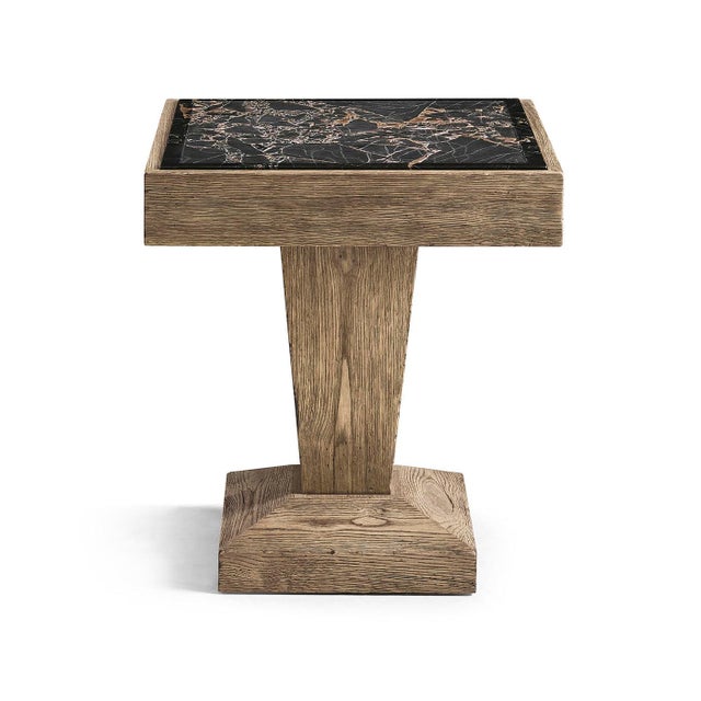 The Side Table with Stone Top brings together solid shapes and natural materials. Its sturdy pedestal base and compact...