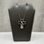 This scattered diamond cross necklace is crafted in sterling silver and features a contemporary cross pendant accented...