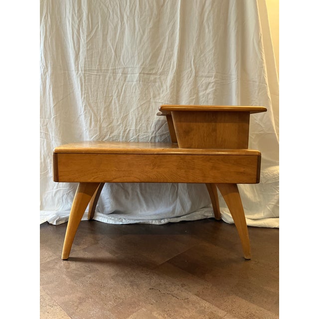 An authentic mid-century staple, this Heywood-Wakefield step table (stamped March 6, 1956) model M321 features the iconic...