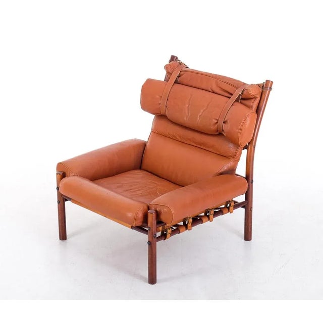 The very comfortable "Inca" chair in original buffalo leather. Designed by Arne Norell, produced by Norell Möbel AB in...