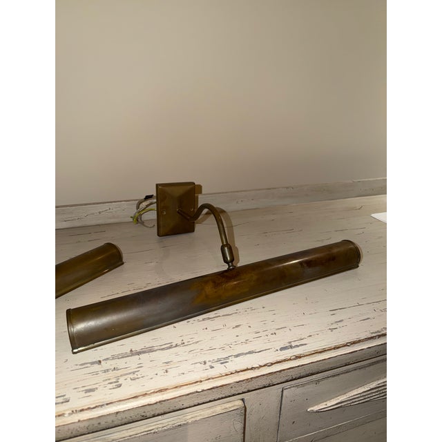 Pair of Robert Kime Picture Lights 18” – a classic picture light with swivel head designed to be wall mounted or on a...