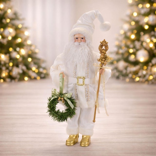 Bring elegant holiday charm to your home with this White Santa Figurine with Wreath and Staff. Dressed in a beautifully...