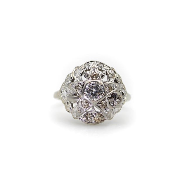 This 14k white gold ring features over a half carat of diamonds and bears the symbol of the Order of the Eastern Star. A...