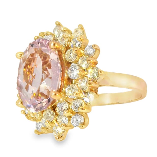 This breathtaking 14K rose gold cocktail ring showcases a stunning oval natural morganite, weighing nearly 5 carats,...