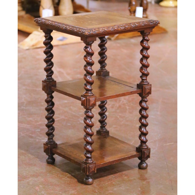 This antique French Louis XIII side table was crafted circa 1870 and is constructed in solid oak. The square top features...