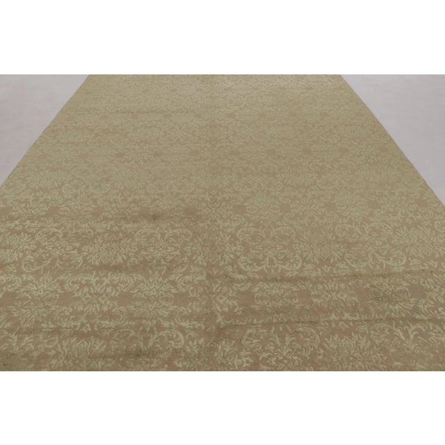 Hand-knotted in wool and silk in our most luxurious Nepalese pile, this 10x14 transitional rug is an addition to the...