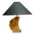 Beautiful pair of mid-century solid textured brass shell table lamps mounted on acrylic bases and with original hard black...