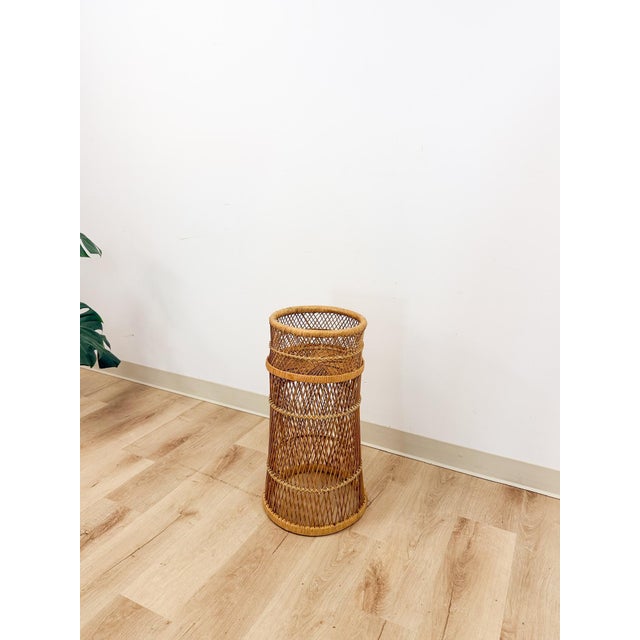 This charming vintage round wicker plant stand is a warm and practical boho and coastal decorative find. The finely woven...