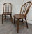 Early 20th Century Antique Rustic Farmhouse Windsor Hoop Back Bow Back Spindle Dining Chairs - Pair For Sale - Image 5 of 10