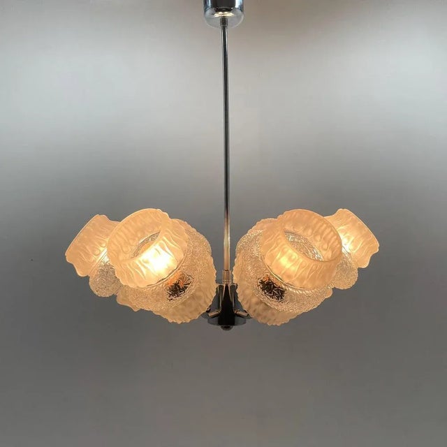 Vintage, clear glass and chrome 6 arm chandelier from the 1970s. Good original condition. Bulbs: 6 x E25-E27. Up to 250V...