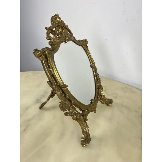 Table mirror in worked brass, Made in Italy, 1960s Intact and in good condition. This piece has an attribution mark, I am...