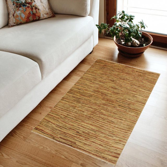 Transform your home's interior with a stunning hand-knotted Gabbeh rug. These rugs are meticulously crafted with bold...