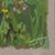 This gouache painting captures a vibrant field of wildflowers, showcasing a lush array of colors amidst a backdrop of soft...