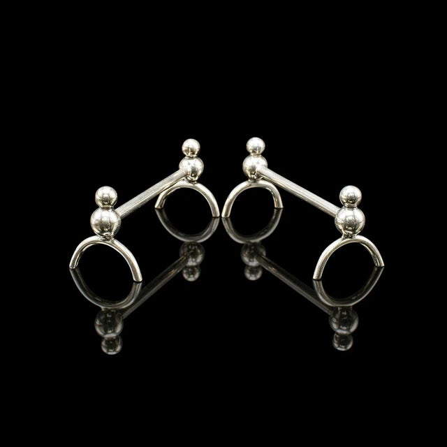 This is a pair of small antique cutlery rests. An English, silver plated condiment spoon rack dating to the Edwardian...