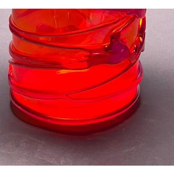 DUTIES INCLUDED A striking expression of form and craftsmanship, this fire-red Murano glass vase embodies the perfect...