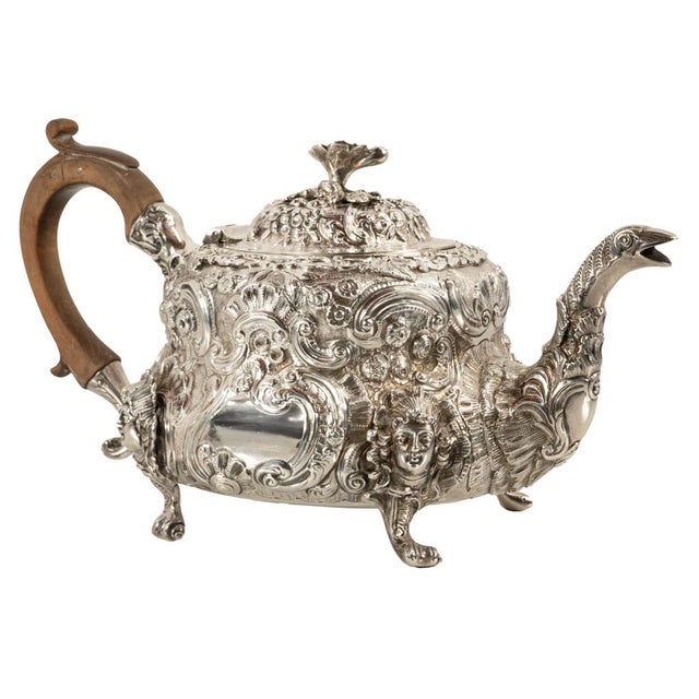 A fine and elegant antique Georgian Regency Rococo Sterling silver teapot, from the reign of King George III, by John...