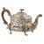 A fine and elegant antique Georgian Regency Rococo Sterling silver teapot, from the reign of King George III, by John...