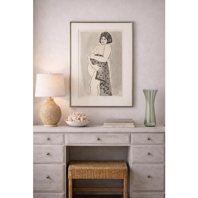 A striking vintage modern figurative ink and wash drawing, presented in a clean, gallery-style frame with a soft neutral...
