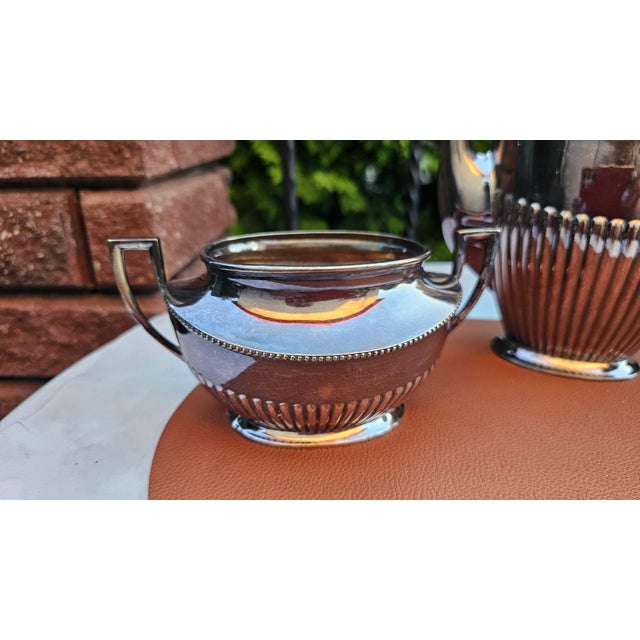 Art Deco silver-plated, sugar, bowl, and milk jug; marked "PRIMA N.S." dimensions: jug – height 23.5 cm, width 22.5 cm,...