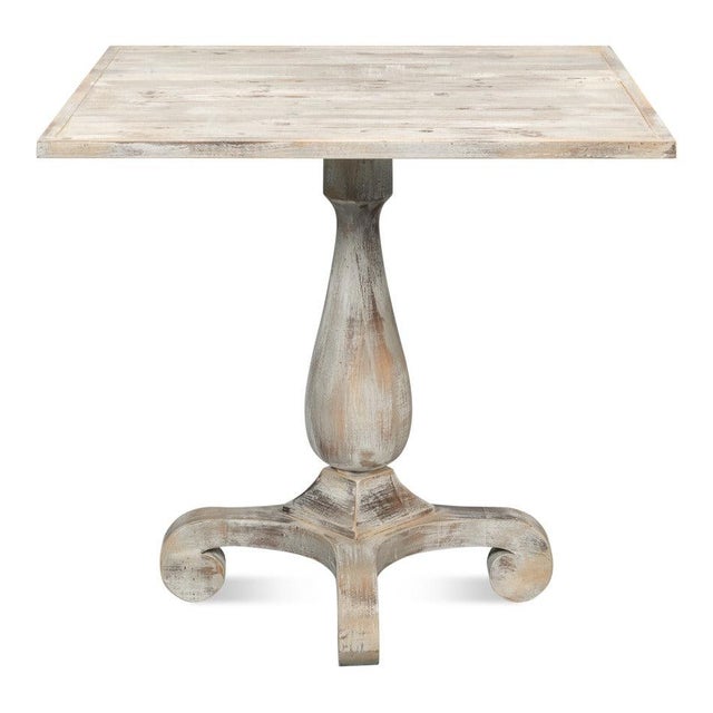 A turned pedestal and a cool oak finish give this small table the relaxed character of European cafe furniture. The grey...
