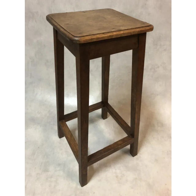 Oak artist's stool with footrest.