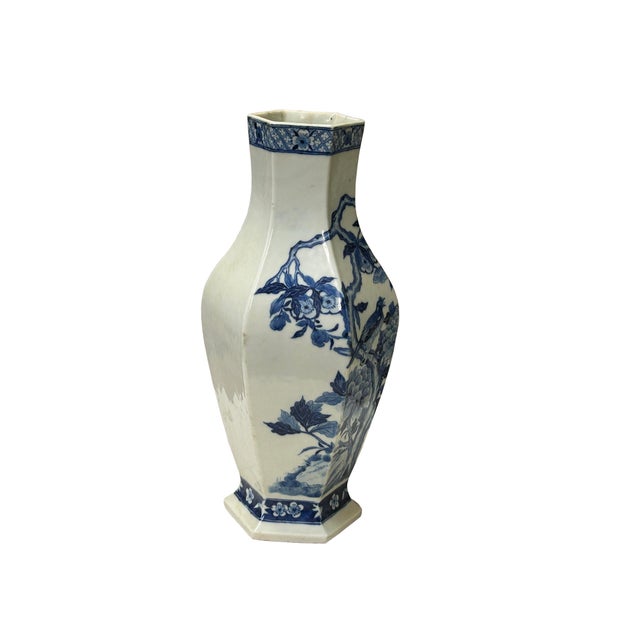 This exquisite antique ceramic vase jar features an elegant hexagonal form, rendered in a classic blue and white...