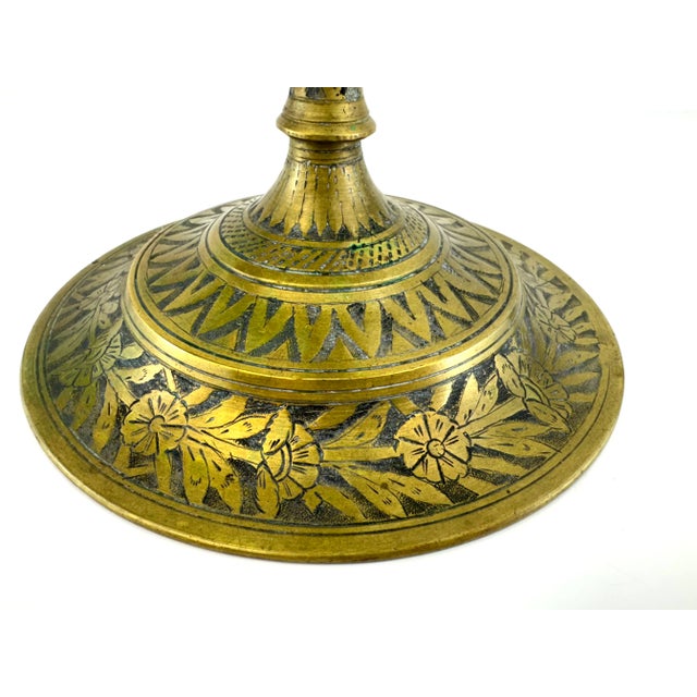 A striking vintage five-arm brass candelabra showcasing exceptional craftsmanship and unique decorative artistry. This...