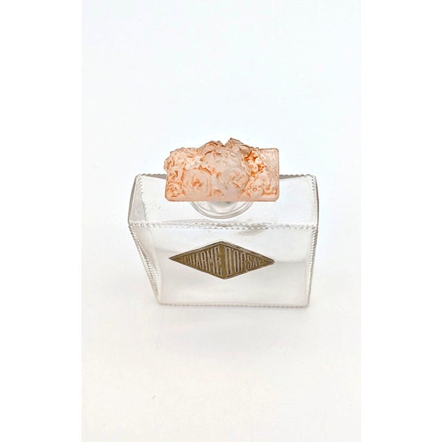 An exceptional and collectible early french art glass perfume bottle, titled "fleurs de france", designed by the legendary...