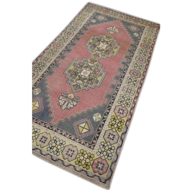 Introducing a one-of-a-kind vintage Turkish hand-knotted wool rug, carefully crafted by skilled artisans using traditional...