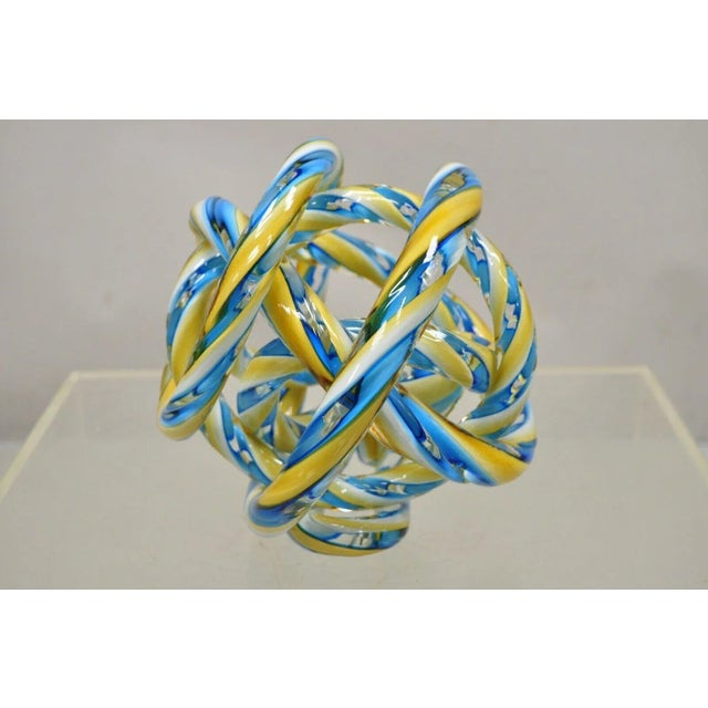 Murano Art Glass Swirl 8" Infinity Knot of Love Blue and Yellow. Circa Late 20th - Early 21st Century. Measurements: 7.5"...