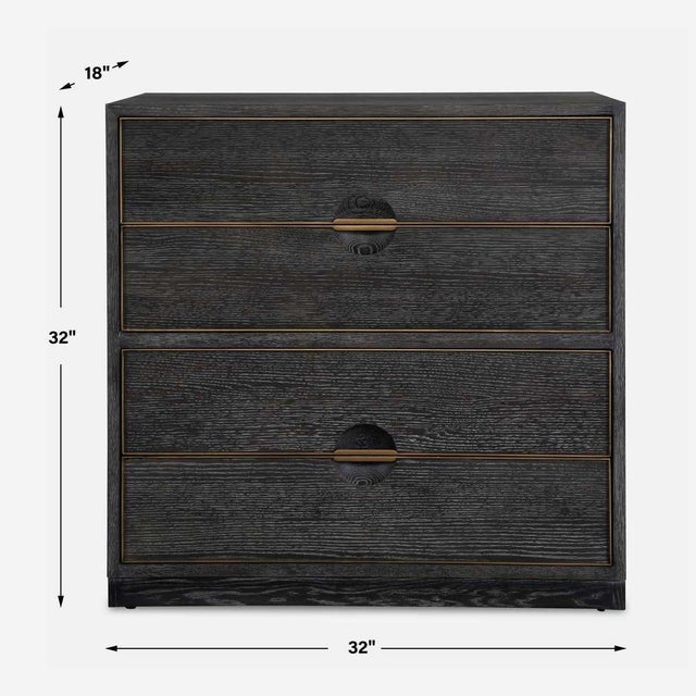 Showcasing refined simplicity, this four drawer chest is layered in a dark walnut finished oak veneer accented with brass...