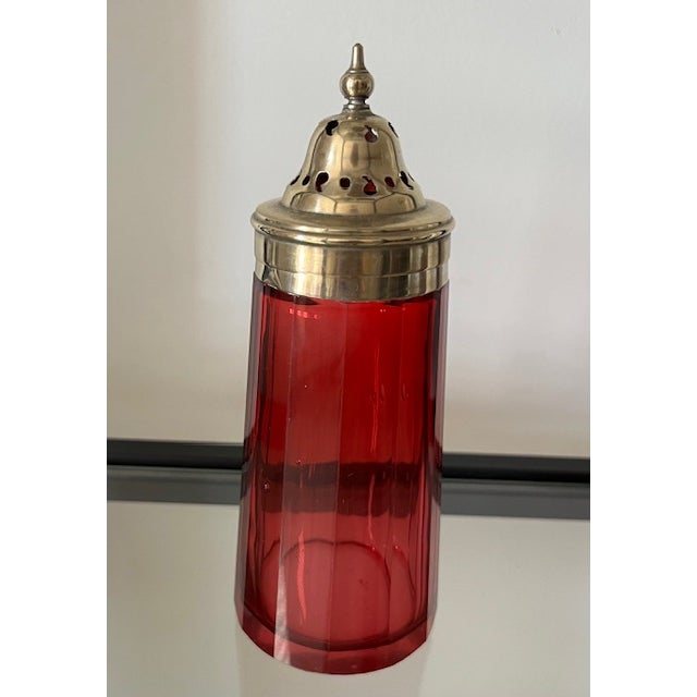 Classic late 19th century cranberry glass muffineer/sugar shaker with gold washed silver plate top stamped EPNS...