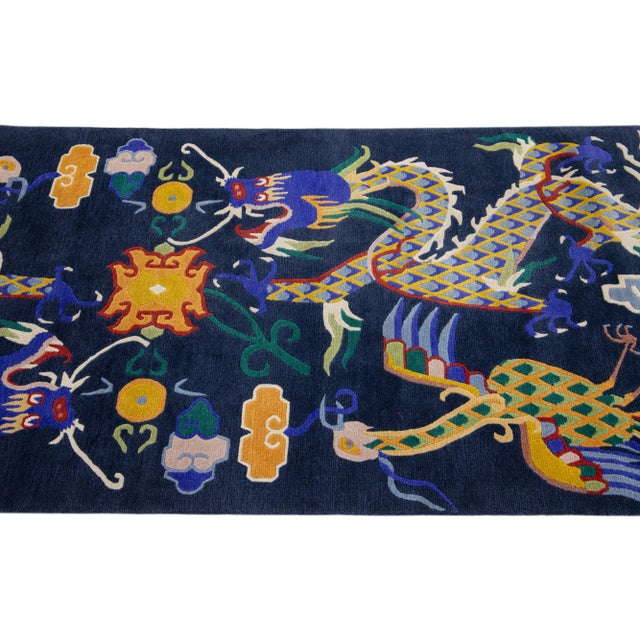Beautiful antique Peking Chinese hand-knotted wool rug with a navy blue field and multi-color accents all-over traditional...