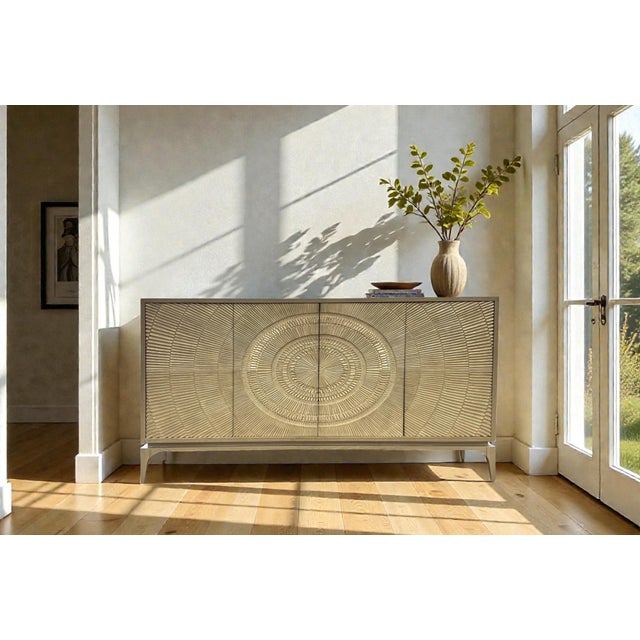 John-Richard Cosmos buffet, featuring an organic modern design with carved doors having a silver-white, radiating pattern...