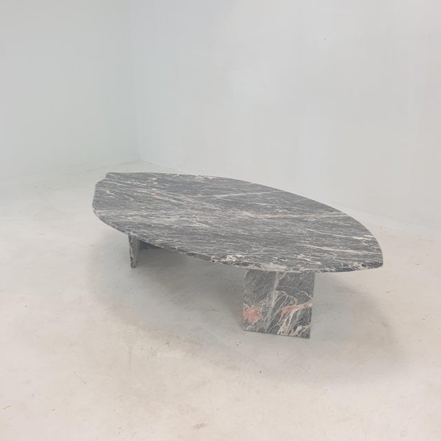 A very nice Italian Coffee Table handcrafted out of marble in the 80's. The fabulous marble features a beautiful pattern...