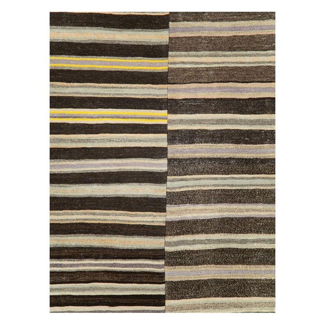 A vintage Turkish flat-weave Kilim accent rug handmade during the mid-20th century consisting of 2 offset striped panels...