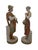A pair of Royal Dux porcelain harvest figures depicting a young man carrying a sheaf of wheat and a sickle, with a cloak...