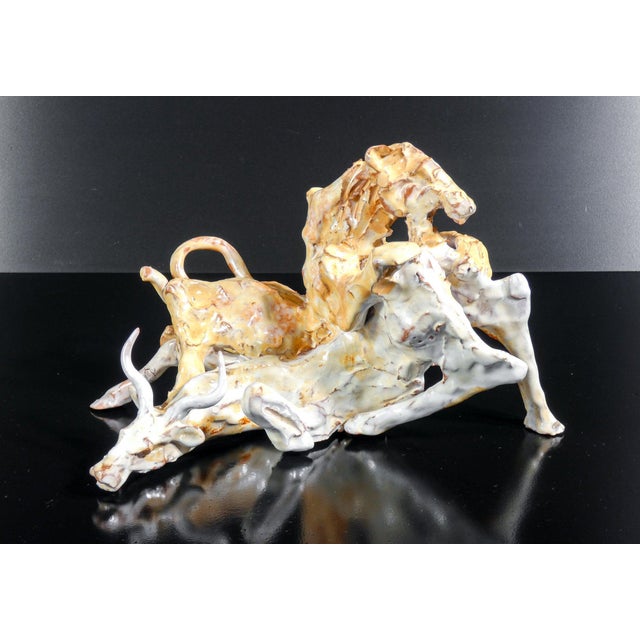 Glazed majolica sculpture depicting a hunting scene, with tiger and wildebeest. Italy, late 20th century origin italy...
