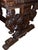 A powerful and architecturally striking Renaissance Revival carved walnut trestle table, dating to the late 19th century...