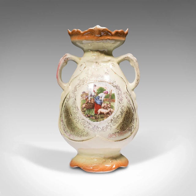 This is a small vintage display vase. An English, ceramic decorative baluster, dating to the early 20th century, circa...