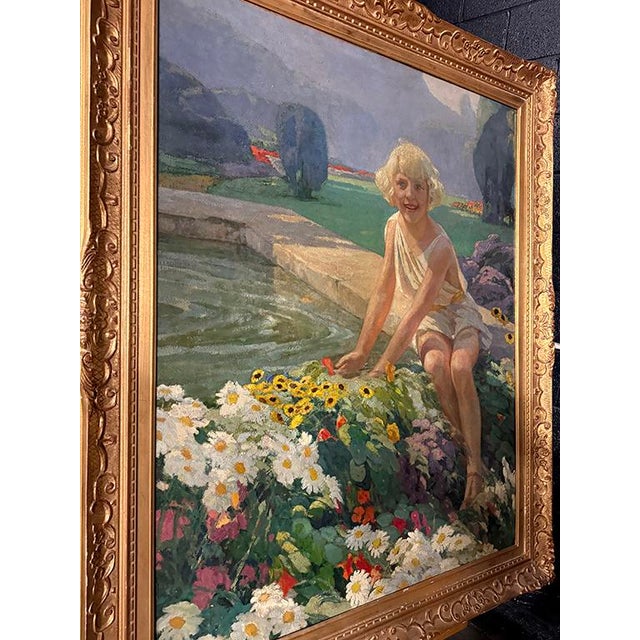 This captivating antique oil painting portrays a joyful young girl with golden curls, dressed in a light, flowing white...