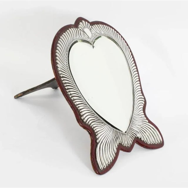 This is a fabulous antique Victorian sterling silver heart shaped easel dressing table mirror, bearing hallmarks for...