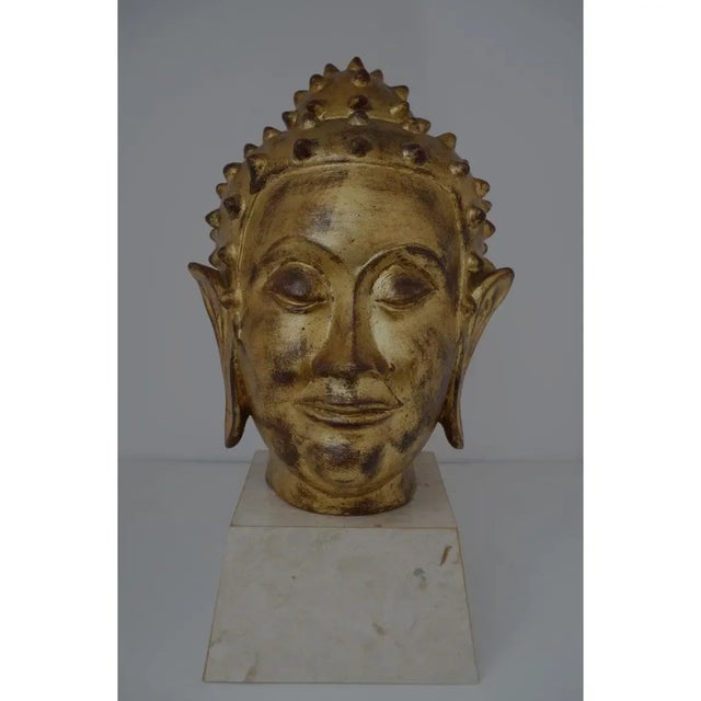 This Italian goldleafed terracotta Buddha head dates to the 1960s-1970s and its serene face will help bring a calmness to...