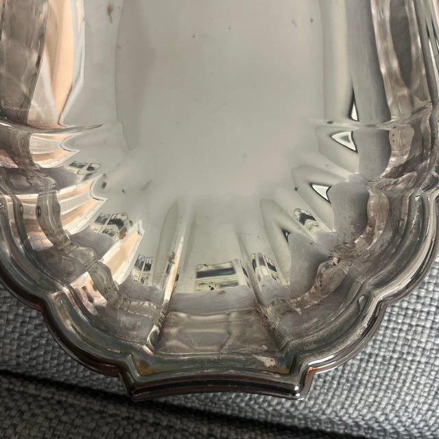 Vintage small plate with scalloped edges. Easy to shine and makes a great little plate for appetizers etc. Marked Gorham...