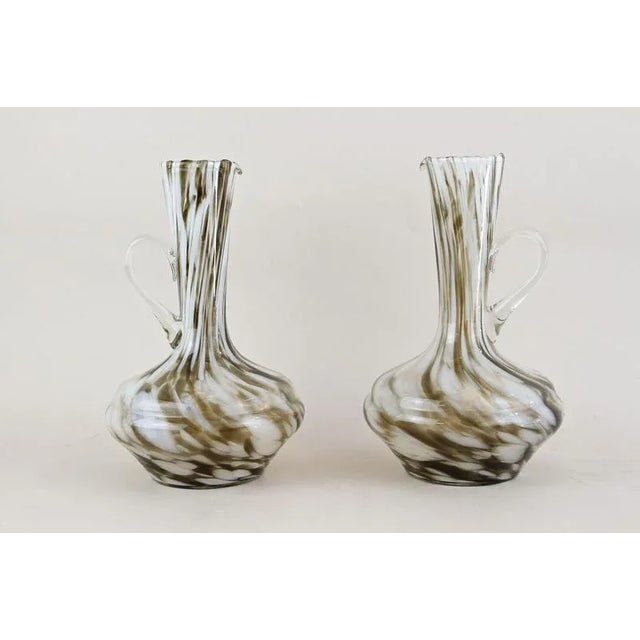 Unique designed pair of Murano glass vases/ carafes out of the famous workshops in Italy from the mid 20th century around...