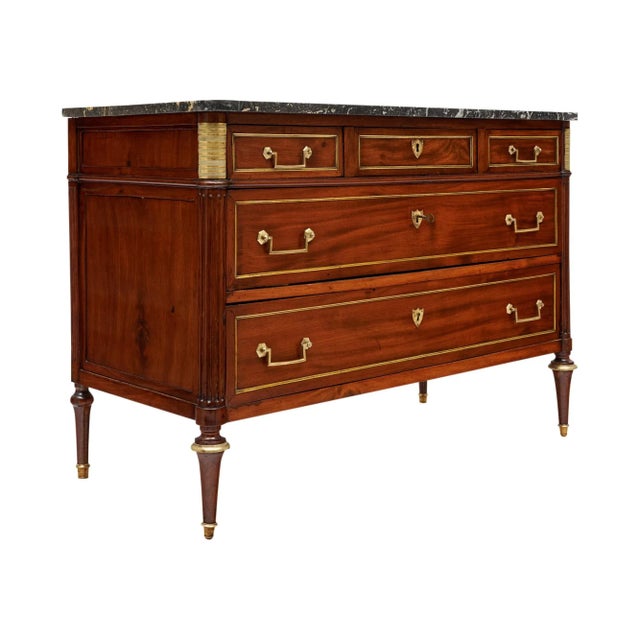 Chest of drawers from the Louis XVI period in France. This piece is made of solid wood construction, primarily mahogany....