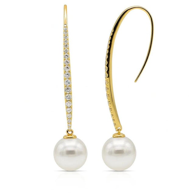 18k Earrings with two 11mm South Sea pearls and 40 round brilliant diamonds weighing 0.56 carats. 7.08g